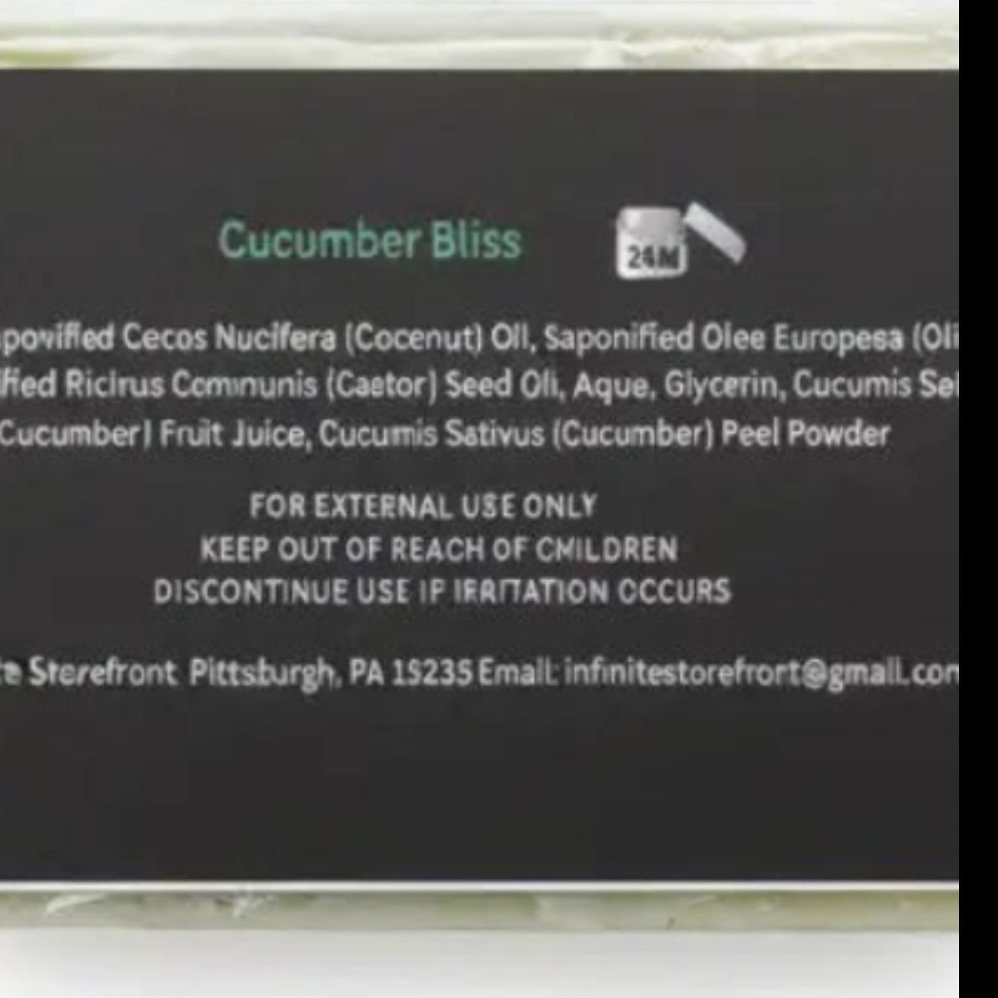 Infinite Storefront Cucumber Bliss handmade body soap bar with fresh cucumber slices and leaves, highlighting plant-based ingredients and small batch craftsmanship.