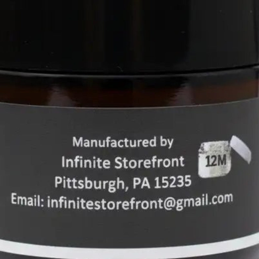 Infinite Storefront Btp Lemon Balm Mint Body Balm in an amber glass jar with a black lid, back label view.